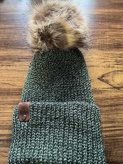 knit cap and fur pompom